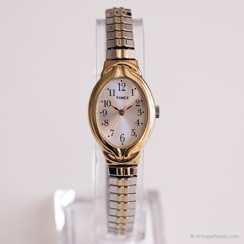 Women's Timex dress watch. Gold oval face with lined store design.