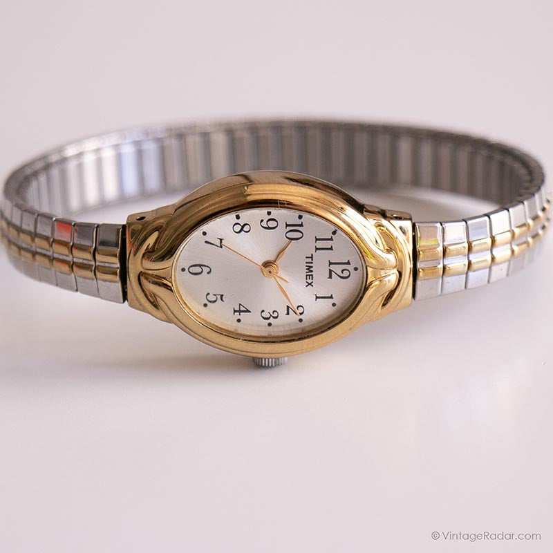 Women's Timex dress watch. Gold oval face with lined store design.