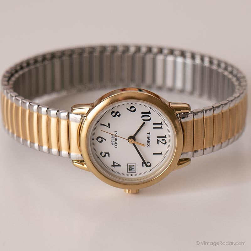 Women's Timex Indiglo watch. Small bracelet band. Gold outlet bevel.