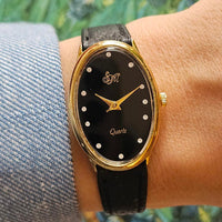 Vintage Black-Dial SM Watch for Ladies Gold-tone Oval Case & Black Strap