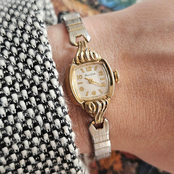 Vintage gold-tone Bulova ladies watch on the wrist 