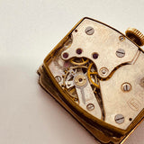 ساعة ألمانية مستطيلة الشكل مطلية بالذهب عيار 15 روبية لقطع الغيار والإصلاح - لا تعمل
