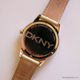 Vintage DKNY Gold-tone Watch for Women with Gemstones & Pearly Dial - Vintage Radar