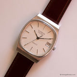 Vintage Dugena DQ280 Watch for Men with Rectangular Case & Date - Vintage Radar