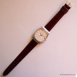 Vintage Dugena DQ280 Watch for Men with Rectangular Case & Date - Vintage Radar
