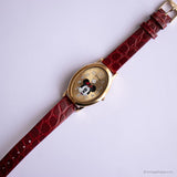 بيضاوي ذهبي اللون عتيق Minnie Mouse ساعة نسائية بحزام أحمر