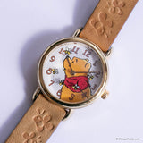 Watch with a cartoon character on the dial against a white background