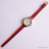 Transporte de tonos de oro vintage por Timex reloj para damas con correa roja