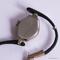 Vintage watch with black strap on a white background