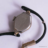 Vintage watch with black strap on a white background