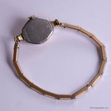 Vintage gold watch with a plain background
