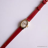 Vintage Gold-tone Timex Ladies Watch with Oval Case and Red Strap