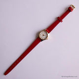Minuscule ton or vintage Timex montre Pour les femmes avec une sangle en cuir rouge