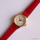 Pequeño tono de oro Timex De las mujeres reloj con correa roja y dial de champán