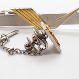 Accessori vintage a due toni: gemelli per spada, clip e perno