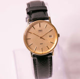 Millésime des années 90 Timex Quartz à tons d'or montre pour les hommes et les femmes