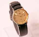 Vintage de los 90 Timex Cuarzo de tono de oro reloj para hombre y mujer