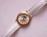 Fase de luna de tono de oro clásico reloj para mujeres con brazalete blanco