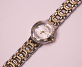 Guess montre pour les femmes en argent avec des détails de ton or vintage