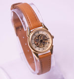 Tone d'or vintage Fossil Quartz montre pour les femmes avec un cadran squelettique