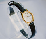 Minimalista Caravelle Fecha de mujeres reloj | Pequeñas damas de tono de oro reloj