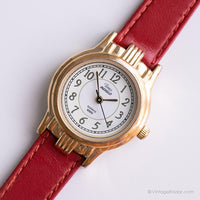 Tono de oro vintage Timex Indiglo reloj para mujeres con correa de cuero rojo