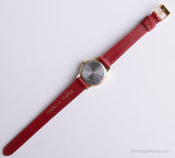 Tono d'oro vintage Timex Orologio indiglo per donne con cinturino in pelle rossa
