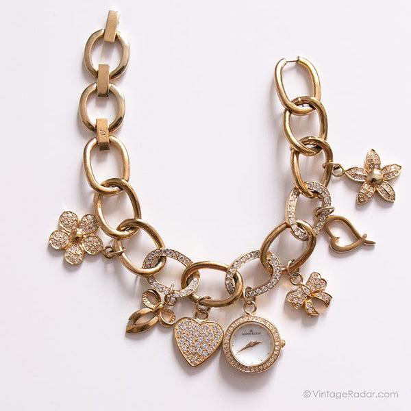 Anne Klein Women's 10-7604CHRM Swarovski Crystal Gold-Tone Charm Bracelet  Watch : Anne Klein: Amazon.in: Fashion