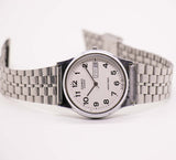 Vintage 1990s Casio Clásico de acero inoxidable reloj para hombres y mujeres