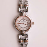 Tono plateado Anne Klein reloj para mujeres con detalles de oro rosa