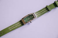 DKNY ساعة مستطيلة اللون الفضية للنساء مع سوار أخضر