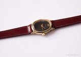 Minuscule ovale vintage montre par Timex | Tonne d'or du cadran noir montre pour elle