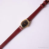 Vintage pequeño ovalado reloj por Timex | Tón de oro de dial negro reloj para ella