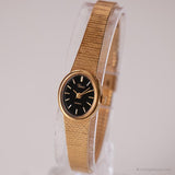 Minuscule ovale vintage Timex montre | Tonne d'or du cadran noir montre pour elle